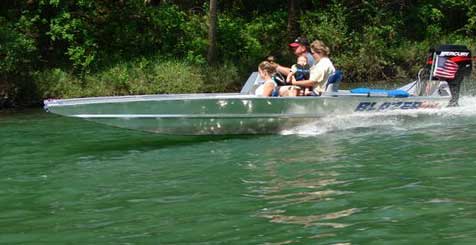 Blazer boat cruising with passengers